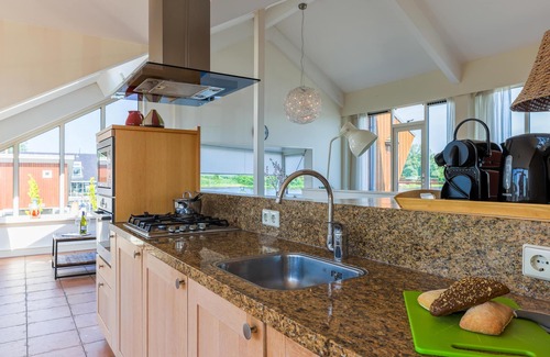 Municipality of Uitgeest Apartment | Modern penthouse with stunning lake views