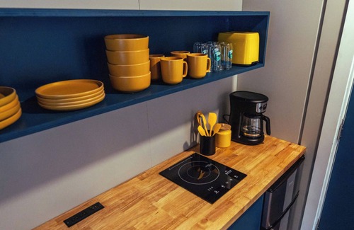 Johnson House | Modern Tiny House with hot tub & river near Stowe