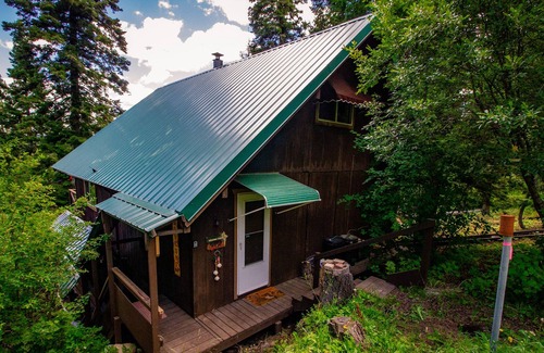 Cascade House | Mountain chalet nestled in the evergreens, peekaboo views of the lake in between