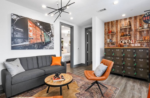 Rolling Mill Hill Condo | Muse | Nashville-themed condo with oversized balcony, downtown views & putting mat