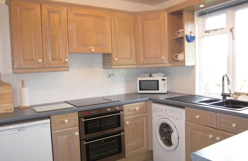 Helford Passage Cottage | Nanteague - quirky luxury chalet-style cottage, sea views across a wooded valley