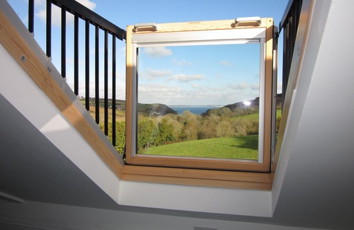 Helford Passage Cottage | Nanteague - quirky luxury chalet-style cottage, sea views across a wooded valley