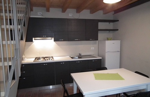 Monzambano Apartment | NEST open-space studio on two levels