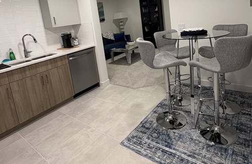 Southeast Calgary Condo | New, stylish suite. Private entrance, queen bed, full kitchen, in-suite laundry.