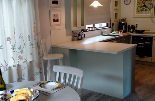 Akaroa House | Newly redecorated & beside th stream sunny seating area Spring is gorgeous here