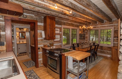 Baileys Harbor House | Newly Remodeled Waterfront Log Cabin with Boat House and Pier