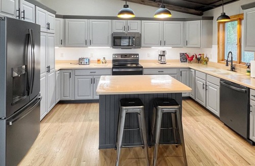 Neillsville House | Newly renovated Lake Side Leisure with boat dock, fire pit, and updated decor in a modern lake home