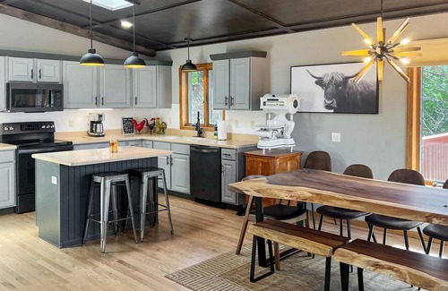 Neillsville House | Newly renovated Lake Side Leisure with boat dock, fire pit, and updated decor in a modern lake home