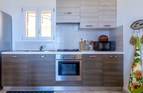 Trinita d'Agultu Apartment | Nice apartment for 4 guests with pool, A/C, TV and patio