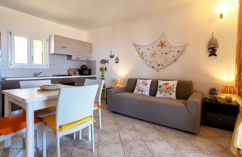Trinita d'Agultu Apartment | Nice apartment for 4 guests with pool, A/C, TV and patio
