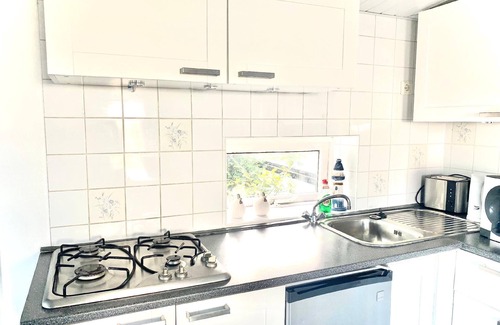 Onderdijk House | Nice holiday home "Isabella" with a view of the water