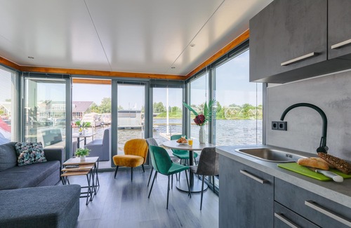Municipality of Uitgeest Boat Rental | Nice houseboat with waterfront terrace
