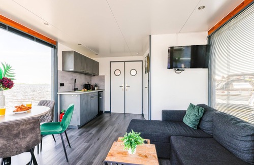Municipality of Uitgeest Boat Rental | Nice houseboat with waterfront terrace