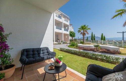 Manilva Apartment | Oasis with terrace and sea view 2BR, garden & pool