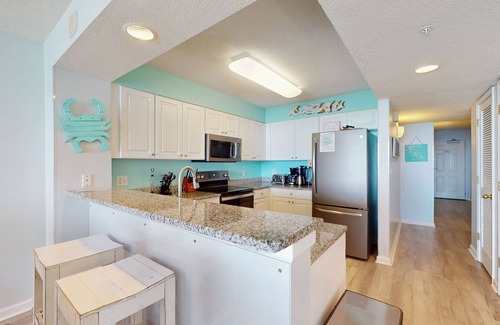 Ocean Drive Condo | Oceanfront condo with pool, hot tub, private balcony & close to golf