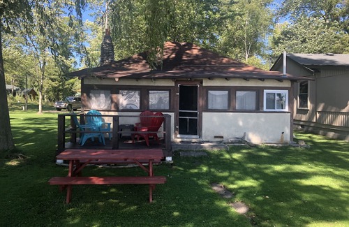 Traverse City House | One-bedroom cabin on Lake Leelanau. Sunset view. Dog considered.