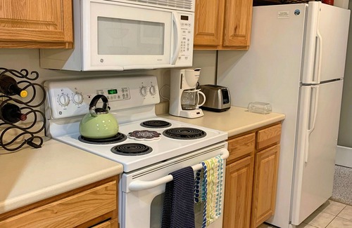 Lincoln Condo | Open concept, comfy, AC/FP, woods view, deck, swim club. F5008 by LRS