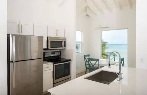 Cockburn Town Condo | Pillory Club: Beachfront Condo with Water Sports and Excursions