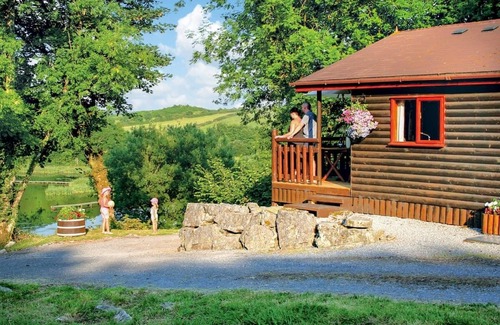 Porthyrhyd Ski Chalet | Pine log lodge with one double and one with bunks and a single.