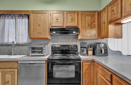 Paupackan Lake House | Pocono retreat with firepit, gameroom, expansive deck - dog friendly