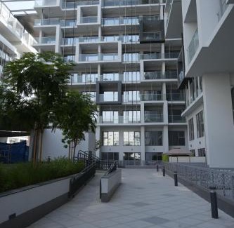 Masdar City Apartment | Poolside Charm
