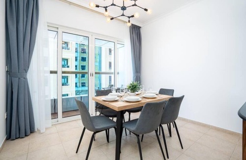 Umm Suqeim 3 Apartment | PoshBeds - Blue light over Marina