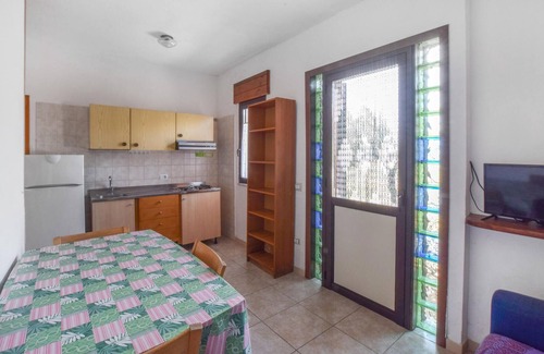 Praia a Mare Apartment | Practical apartment with open terrace and communal pool.