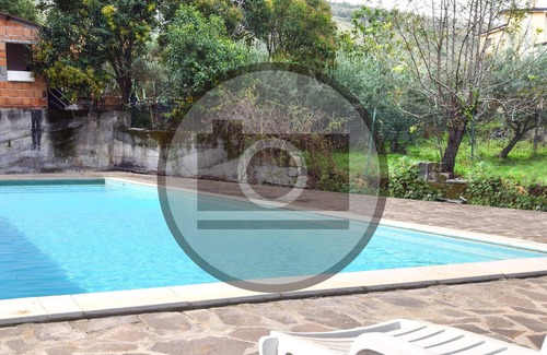 Praia a Mare Apartment | Practical apartment with open terrace and communal pool.