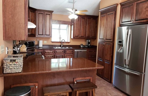 North Northwest Pensacola House | Private Getaway with Screened Pool, Upscale Kitchen, & Large Private Fenced Yard