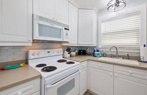 Holiday Isle Villa | Private Resort Villa Beach Service Included Golf Cart Boat and Trailer Friendly