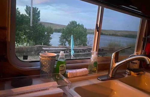 Swanlake House | Queen and twin bed Trailer on private beach, Hammocks, tiki torches, fishing