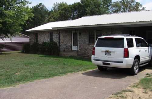 Atkins House | Quiet neighborhood with covered patio & plenty of space for family and friends!