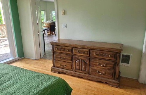 Powell River House | rainforest suite with a king size bed