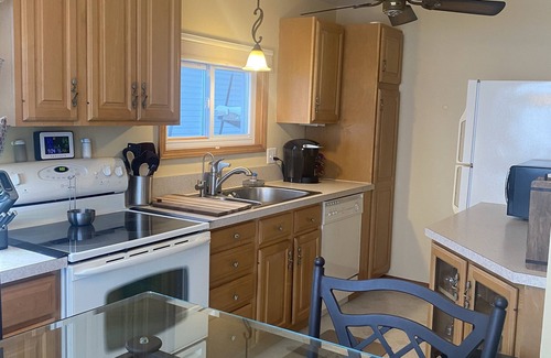 Lake House | Relax at the outdoor firepit or hot tub overlooking all-sports Eight Point Lake!