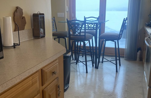 Lake House | Relax at the outdoor firepit or hot tub overlooking all-sports Eight Point Lake!