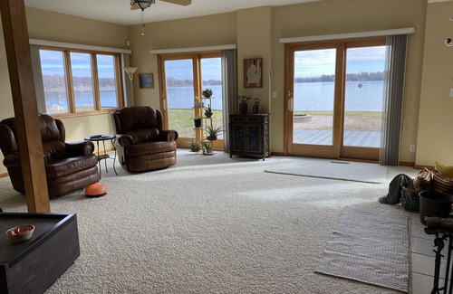 Lake House | Relax at the outdoor firepit or hot tub overlooking all-sports Eight Point Lake!