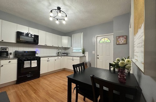 Cleveland House | Relax & Work in Style: 2BR Home with Private Office & Yard