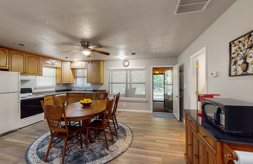Kingston House | Relaxing escape on a large lot with a washer/dryer, sunroom, & firepit