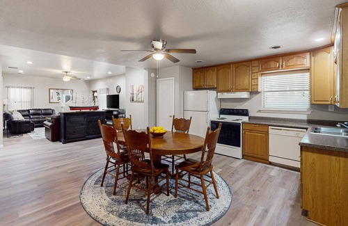Kingston House | Relaxing escape on a large lot with a washer/dryer, sunroom, & firepit