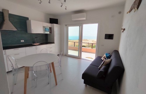 Torre dei Corsari Apartment | Renovated house overlooking dunes and pristine sea.