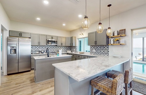 Lake Placid House | Renovated lakefront retreat with screened pool, private dock, patio, grill & W/D