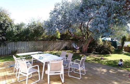Waitarere Beach House | Renovated oasis with large deck and leafy privacy