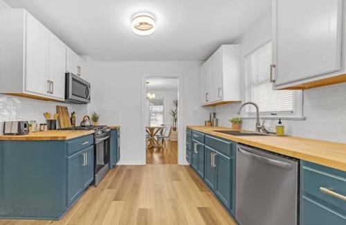 Turner Park House | Renovated Spacious Mansion near TU and Gathering Place. Pet/Family Friendly!
