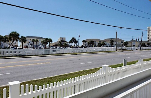 Emerald Coast Apartment | Renovated Studio condo with partial view of beach dunes-Beach Service included
