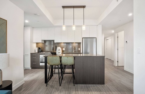 Eau Claire Apartment | River Views w XL Patio, Parking, Office, 2BR