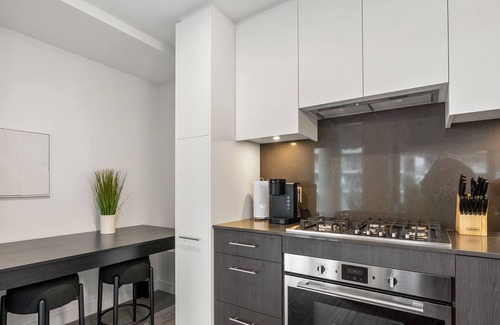 Eau Claire Apartment | River Views w XL Patio, Parking, Office, 2BR