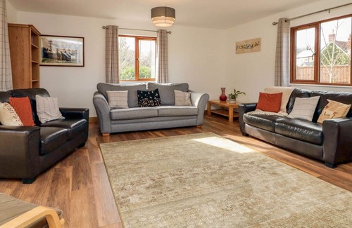 Old Cleeve Cottage | RIVERSIDE LODGE, pet friendly, with a garden in Washford