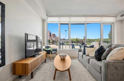 Downtown Calgary Apartment | Riverside Retreat - Enjoy Walking Trails, FREE Banff Pass, Gym, Wine & Parking! Work Space Included!