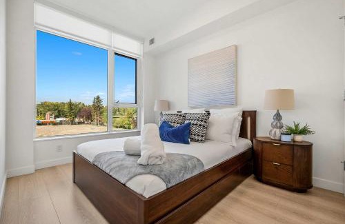 Downtown Calgary Apartment | Riverside Retreat - Enjoy Walking Trails, FREE Banff Pass, Gym, Wine & Parking! Work Space Included!