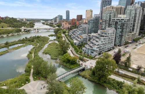 Downtown Calgary Apartment | Riverside Retreat - Enjoy Walking Trails, FREE Banff Pass, Gym, Wine & Parking! Work Space Included!